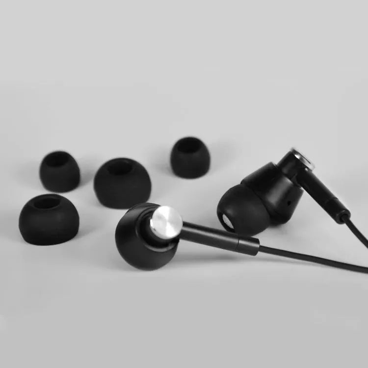 Black and white wired in-ear earphones with 3.5mm audio jack for computer and mobile phone connectivity