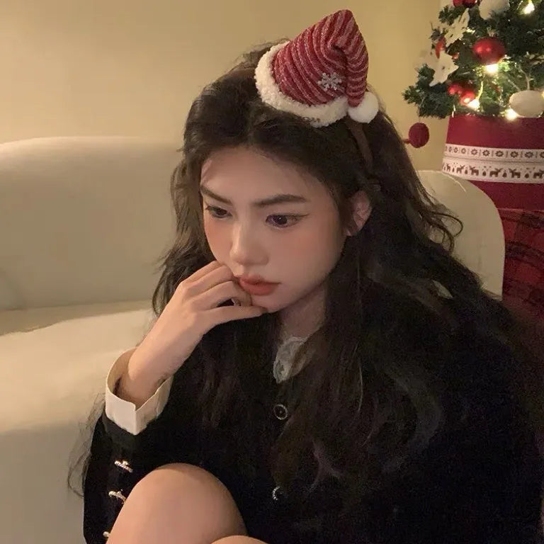 Plush Christmas hair accessory for women with jingling bell, available as headband or duckbill clip