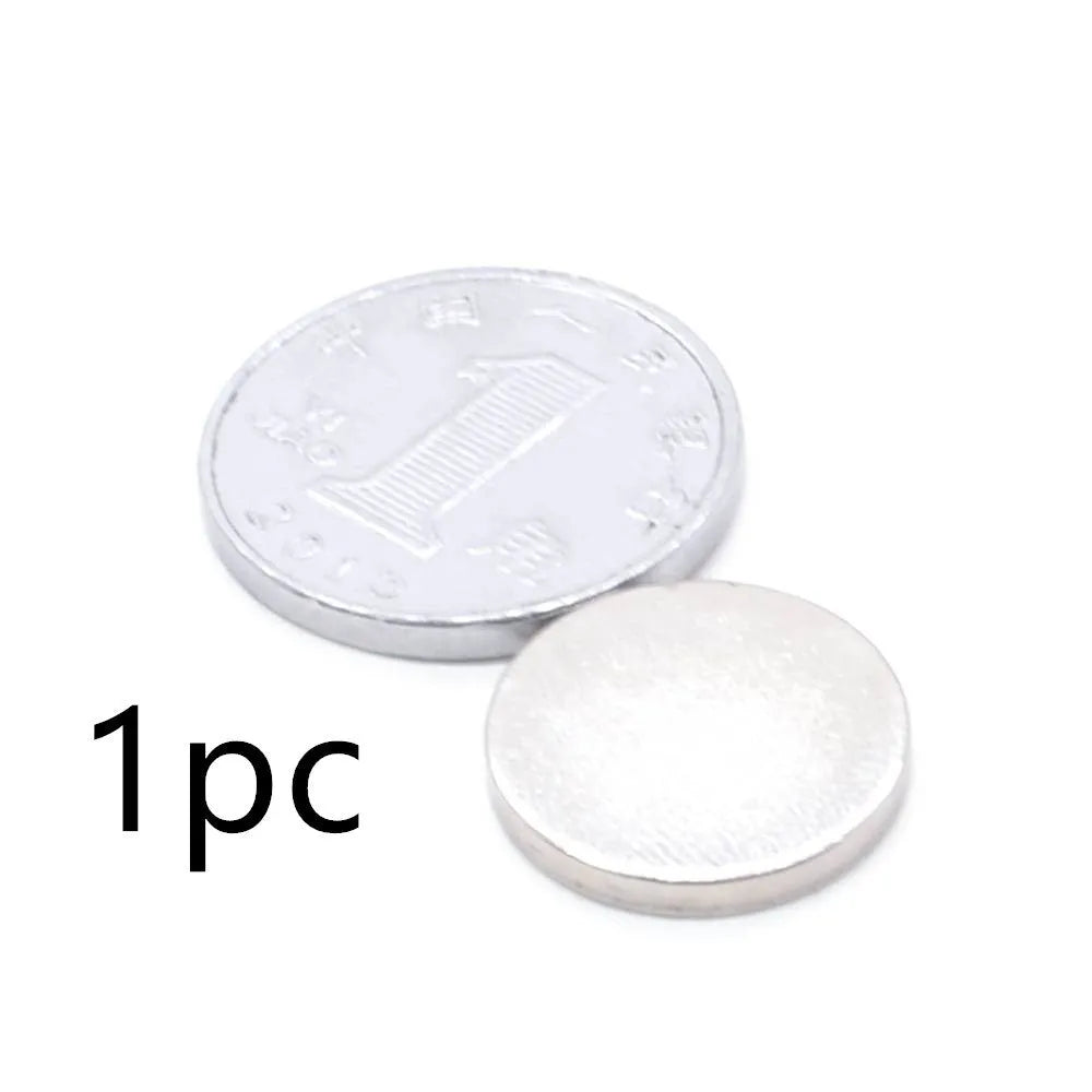 Rare earth NdFeB magnet disc 14x2mm silver N35 grade on white background