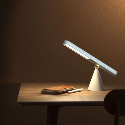 Versatile geometric desk lamp with wireless, magnetic, and multifunctional features for modern workspace lighting