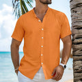 Man wearing a light blue loose fit short sleeve cardigan shirt with a henry collar.