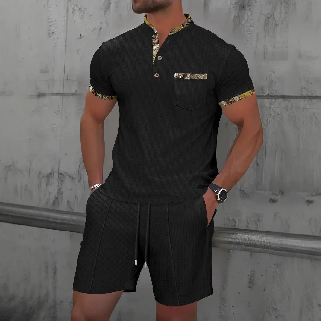 Men's grey waffle weave polo collar short sleeve suit with matching shorts laid flat.