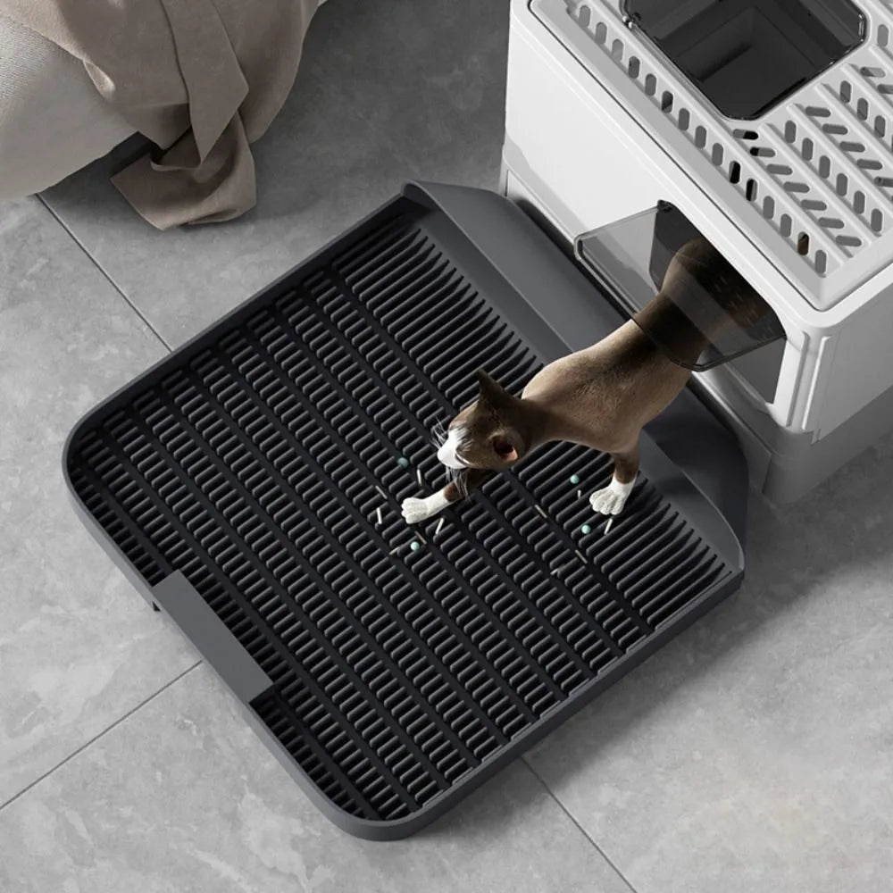 Large black cat litter pedal with slanted mouth design and textured surface for litter containment