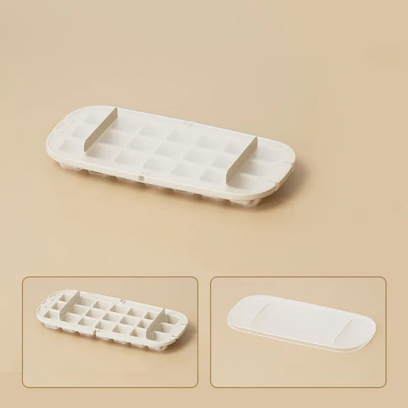High capacity plastic ice cube tray grid in blue with an ice shovel stored in a dedicated slot.