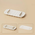 High capacity plastic ice cube tray grid in blue with an ice shovel stored in a dedicated slot.