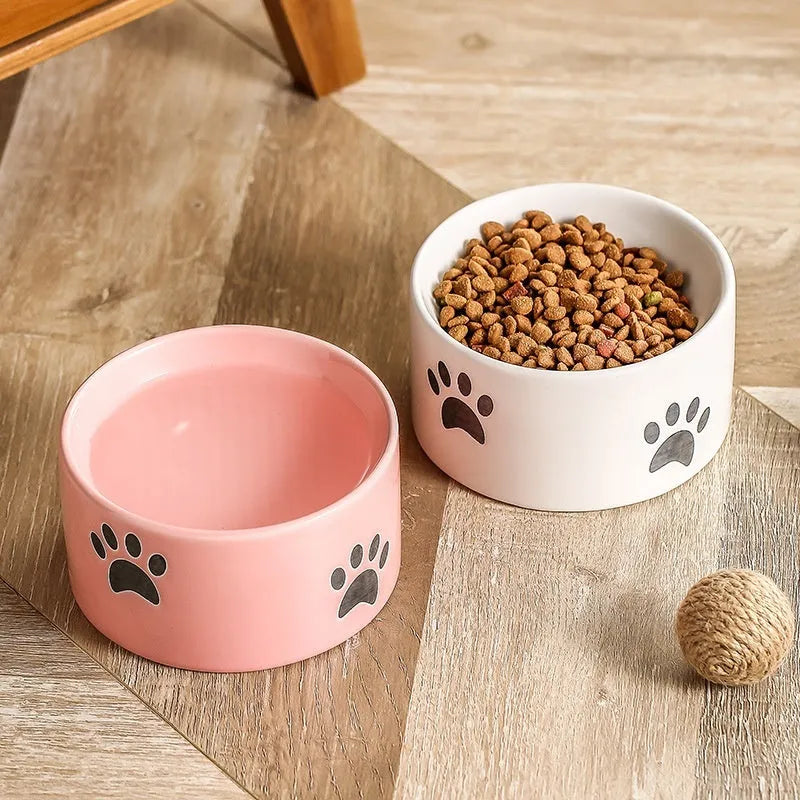Ceramic cat bowl with oblique mouth and high foot in cat's paw black colour
