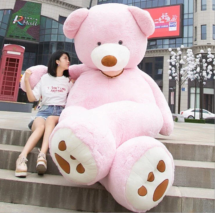 A plush, giant teddy bear with realistic facial features and a soft, huggable design