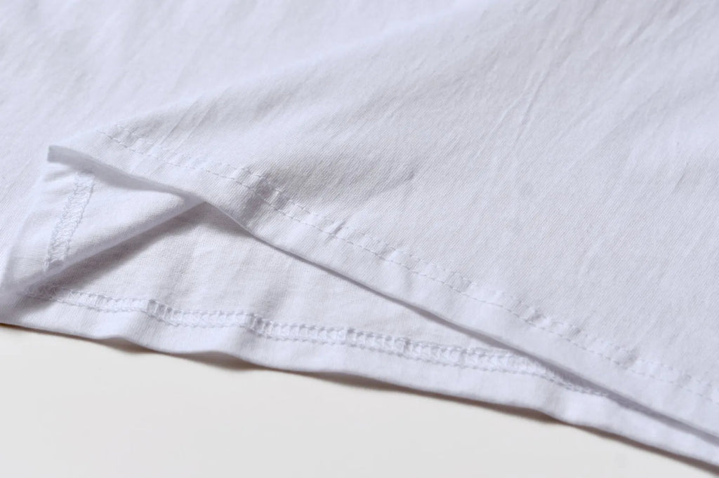White cotton overalls with pattern design, short sleeves and round neckline for teenage summer wear