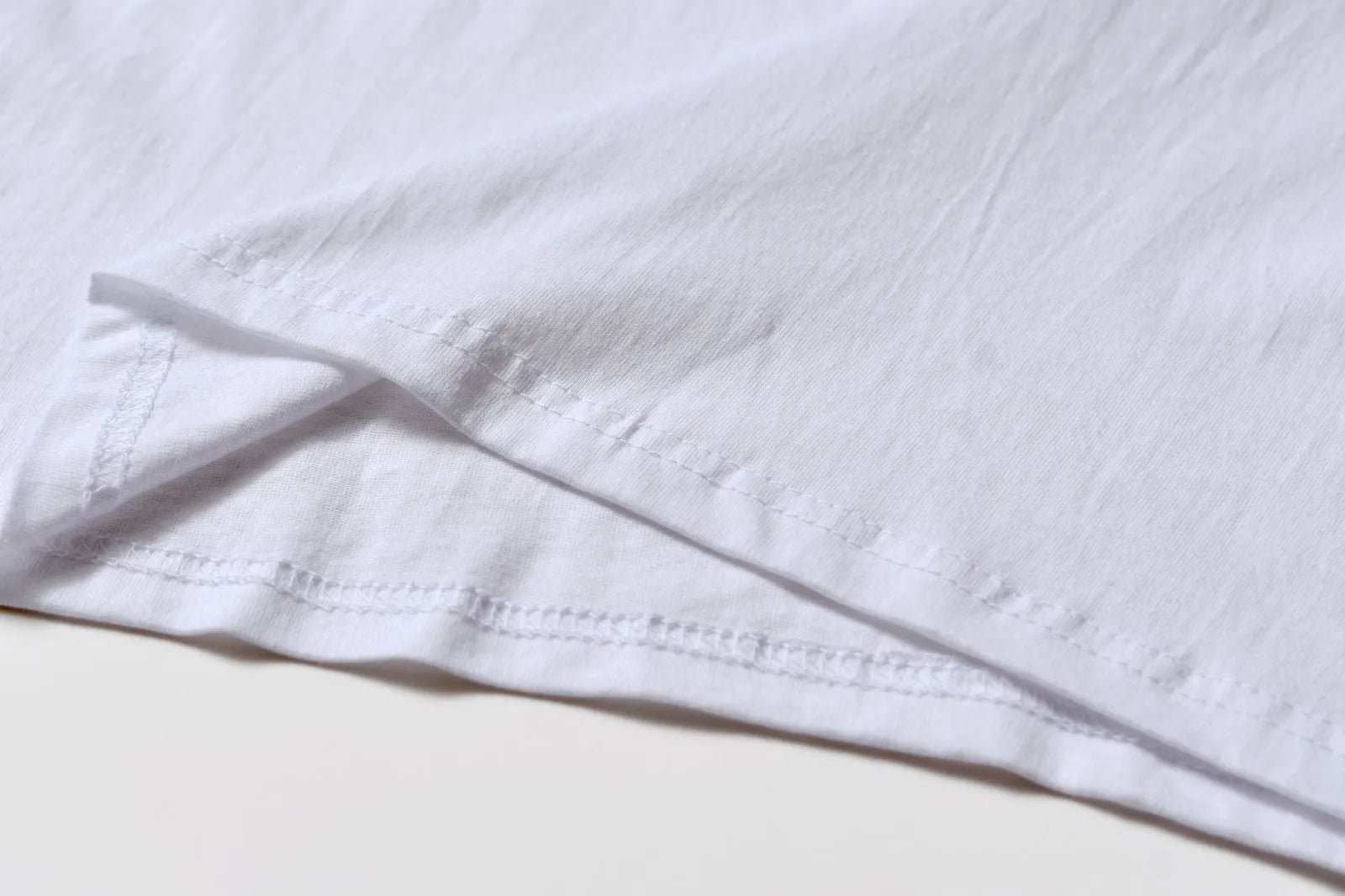 White cotton overalls with pattern design, short sleeves and round neckline for teenage summer wear