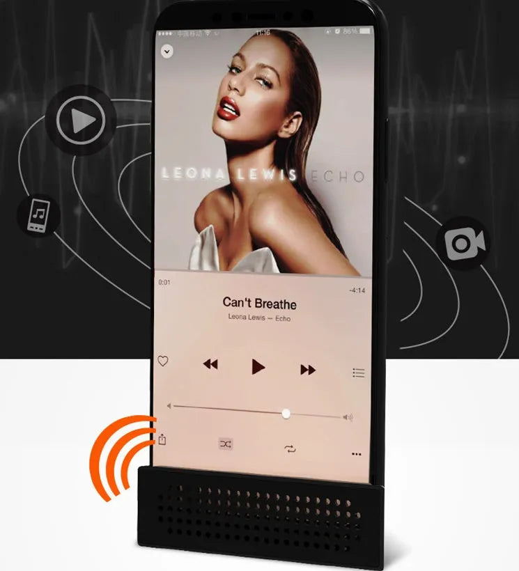 Mini black ABS plastic mobile phone amplifier bracket holding an iPhone on a desktop.