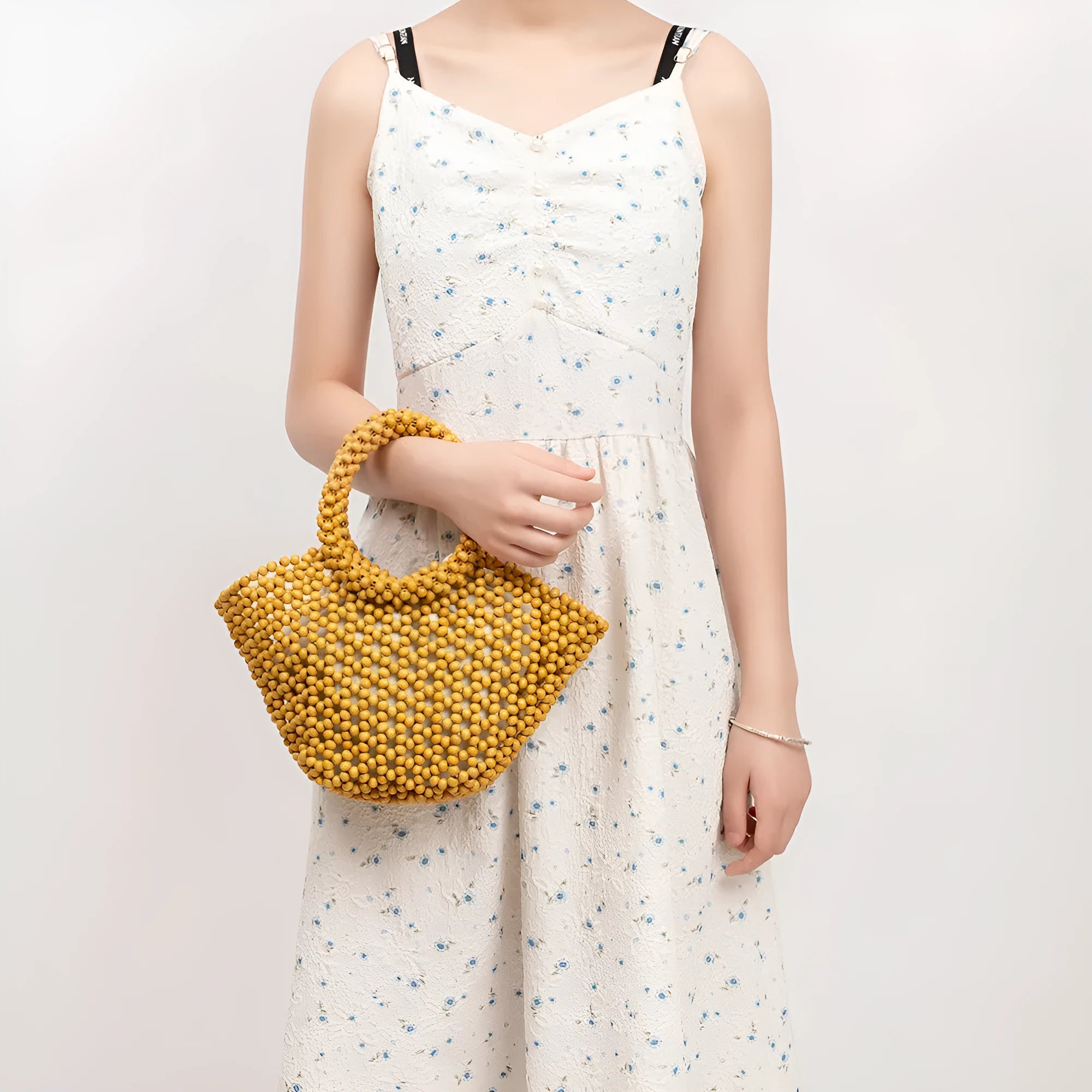Hand-woven wooden bead beach handbag dumpling shape turmeric colour 13x7x18cm