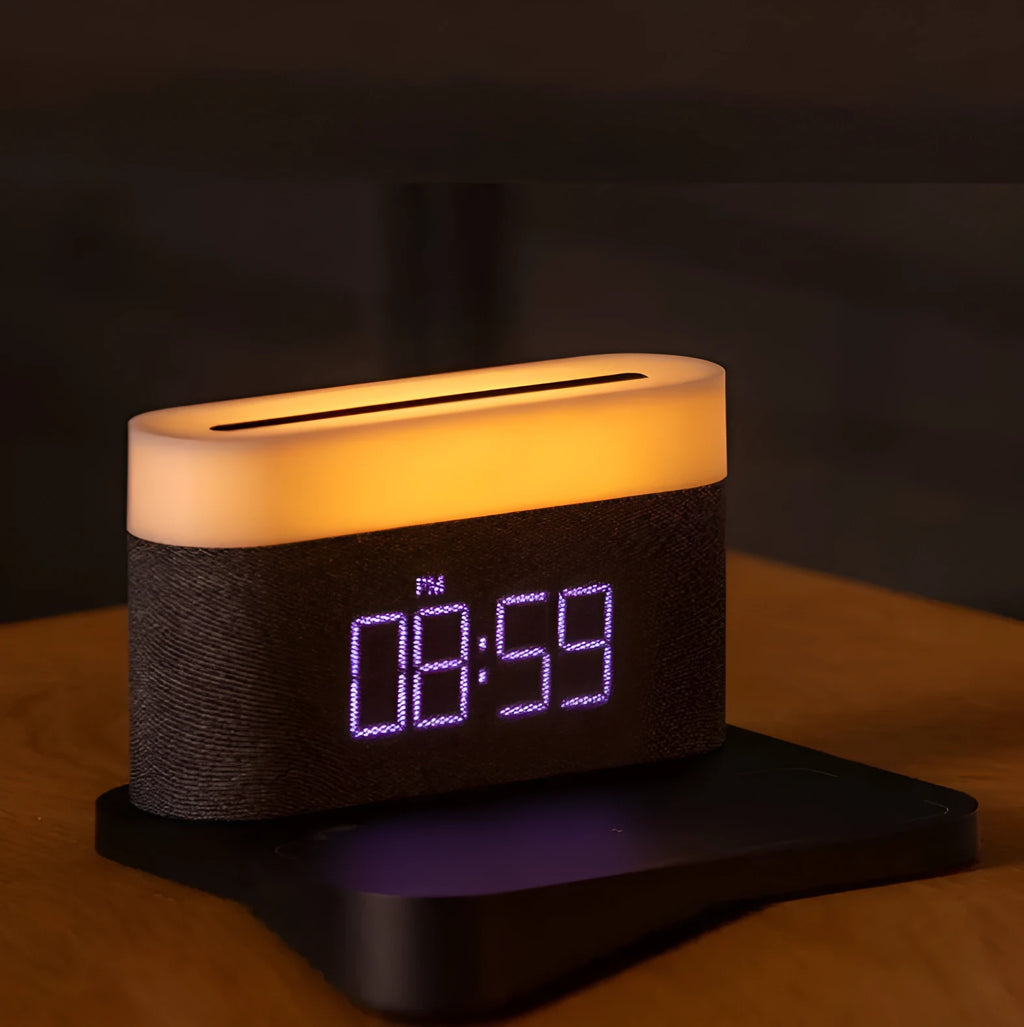 Black and white multifunctional table lamp with integrated digital clock and wireless phone charging pad