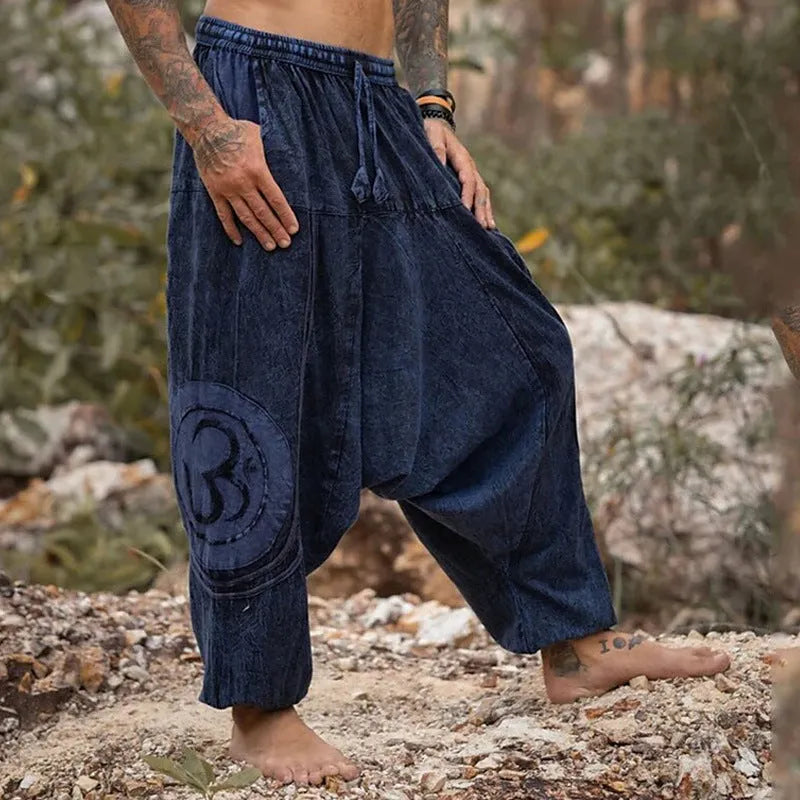 Dark green men's casual trousers with ethnic pattern and ankle-tied closure