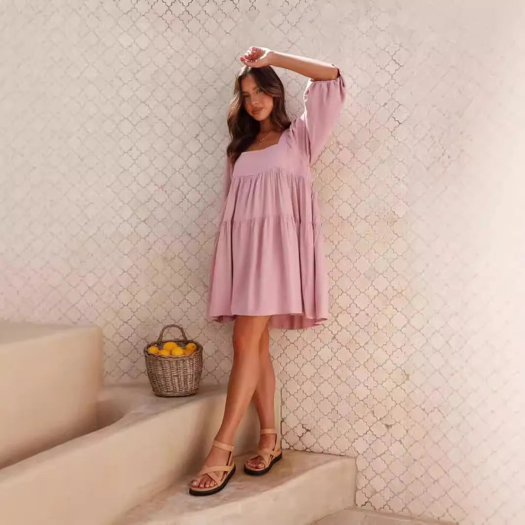 Orange backless A-line dress for a girl with a square collar and puff sleeves.