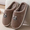 Women's plush rabbit plaid design house slippers with artificial fur and a light brown anti-slip rubber sole.