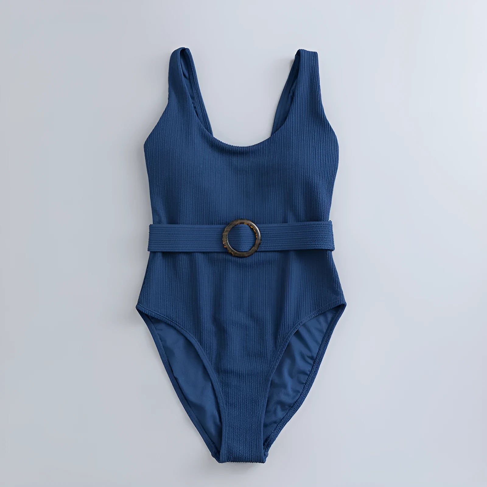 Navy blue one-piece women's swimsuit with a triangle neckline and slimming fit on a mannequin.
