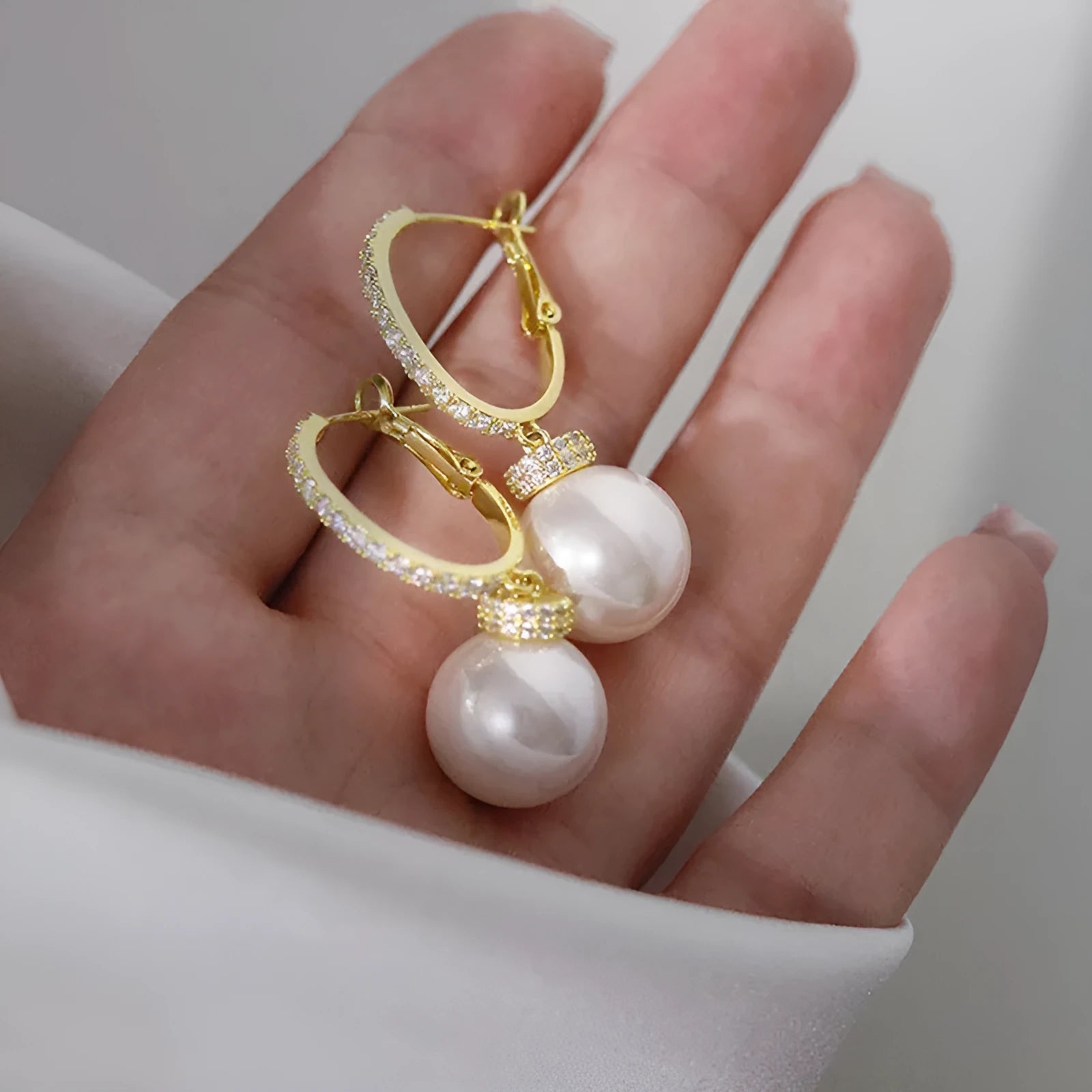 Yellow gold copper earrings with imitation pearl and inlaid zircon geometric ring design