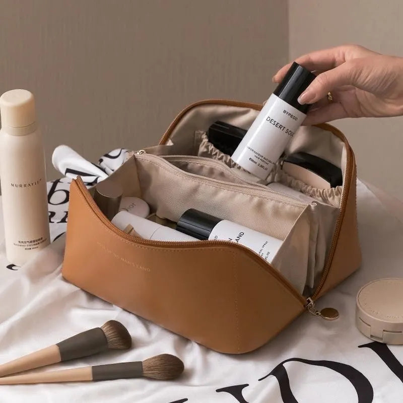 Large capacity travel makeup storage bag in brown PU leather with solid colour finish on white background