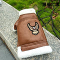 Black leather dog jacket shown on a medium-sized dog, with brown vest option visible.
