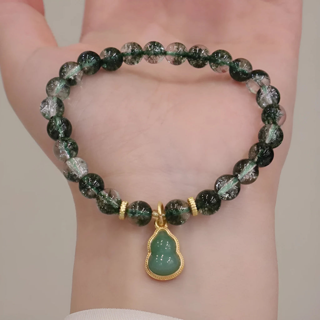 Women's crystal bracelet with citrine, chorite beads and green phantom quartz ghost calabash pendant.