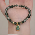 Women's crystal bracelet with citrine, chorite beads and green phantom quartz ghost calabash pendant.