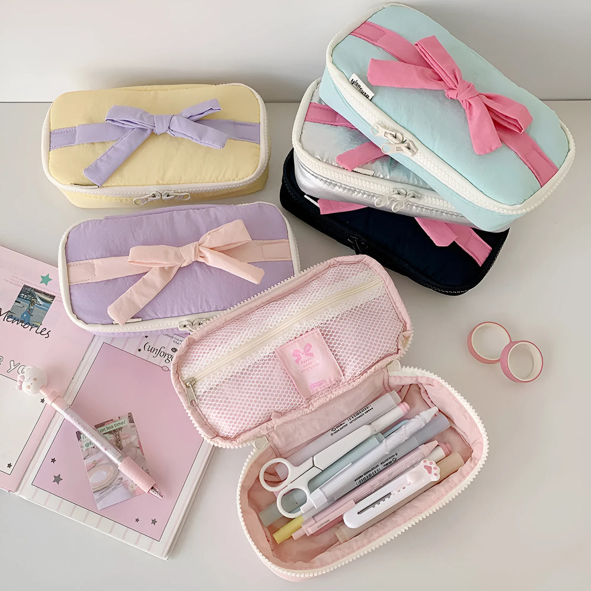 Soft polyester cotton pencil case with minimalist bow design, available in six colours including pink, black and yellow