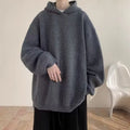 Men's loose fit hooded sweater in gray with long sleeves, shown as a front view pullover knitwear coat