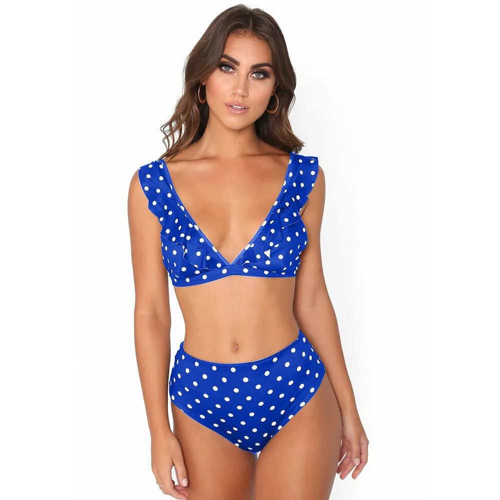 Women's black and white polka dot bikini set with ruffled deep V-neck top and matching shorts.
