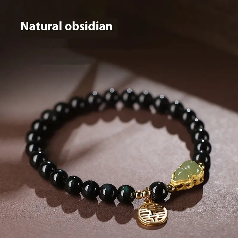 Black obsidian bracelet with Hetian jade gourd charm in geometric pattern
