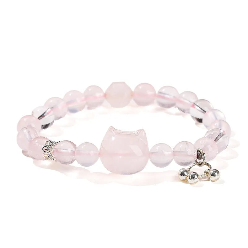Women's natural gemstone charm bracelet with cat head design and copper detailing