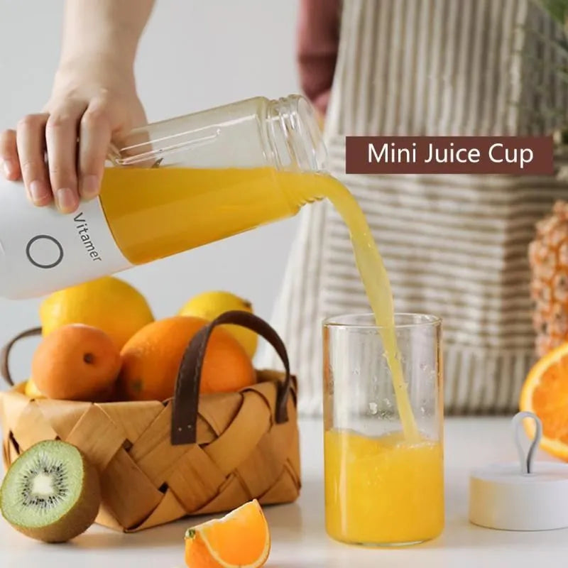 White portable USB blender bottle with silicone handle and stainless steel blade inside.