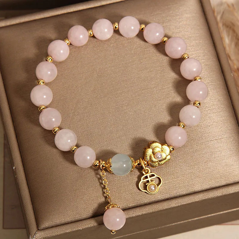 Women's pink crystal flower bracelet with adjustable fit on wrist