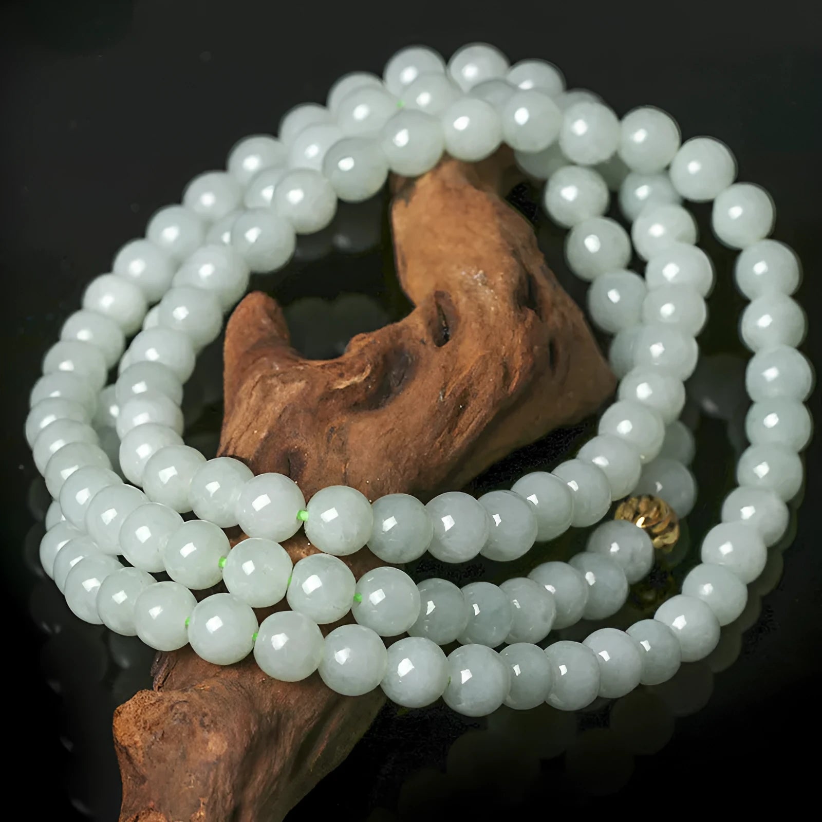 Adjustable jade bead necklace with 6.5mm round beads showing white and green colour variations