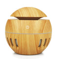 Planet portable USB humidifier in dark wood finish with single fog outlet