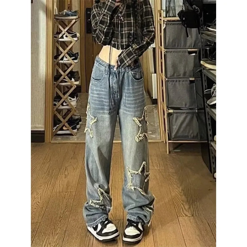 Blue high-waisted wide-leg denim jeans with straight-leg design on hanger