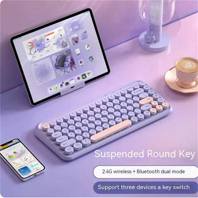 Star Purple three-mode wireless keyboard and Bluetooth mouse set on a desk