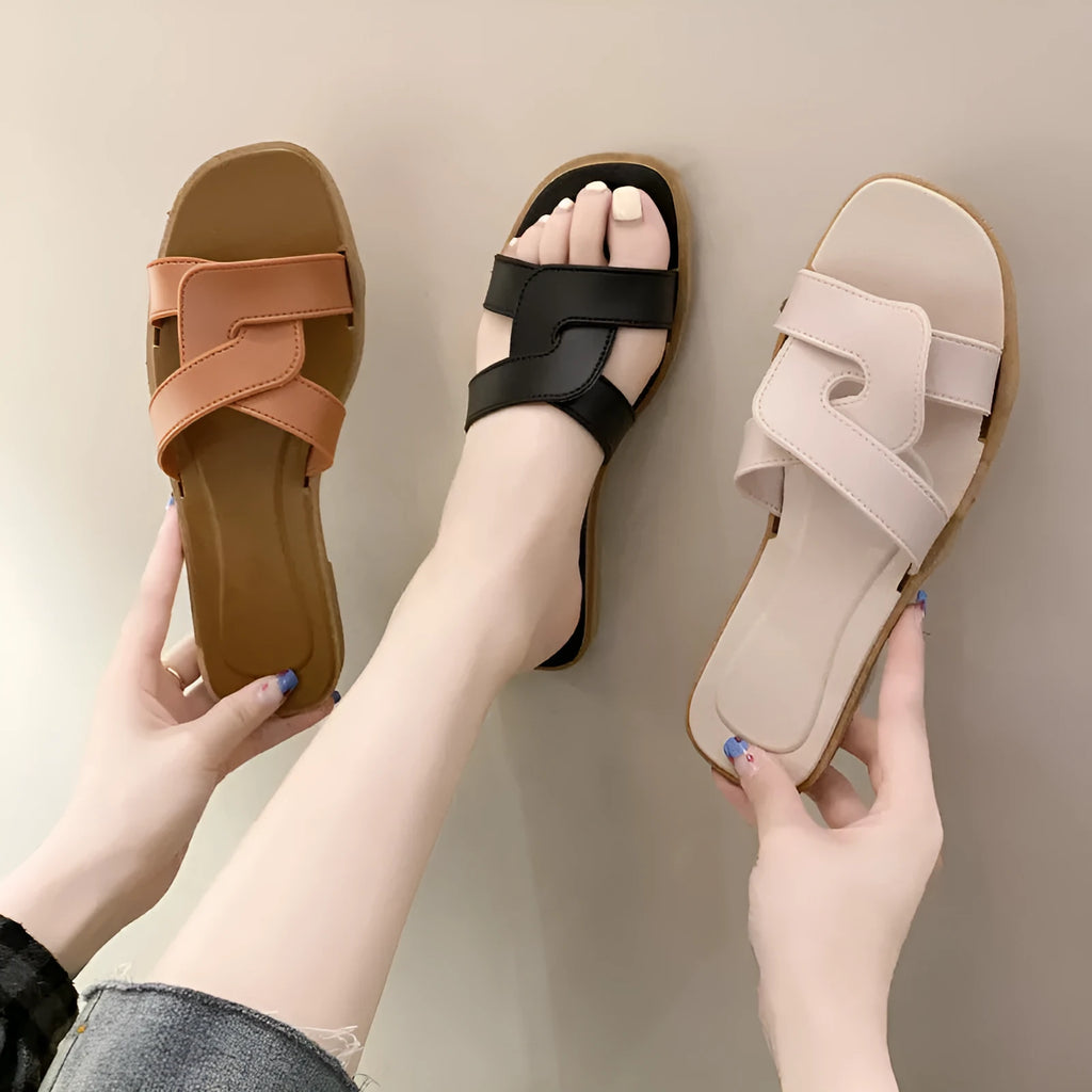 Women's cross strap PVC sandal in light blue with a toe ring and non-slip sole.