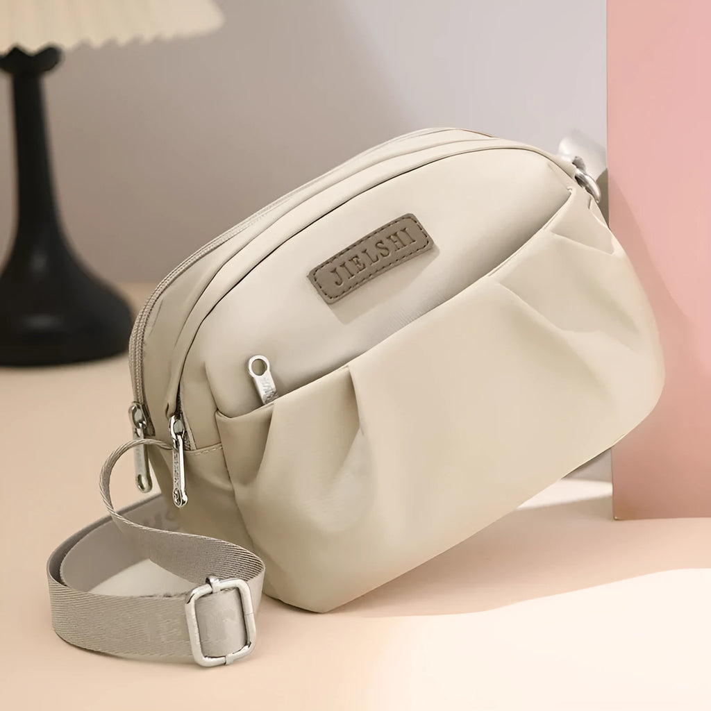 Pleated oxford cloth messenger phone bag with zip compartments in ten colour options