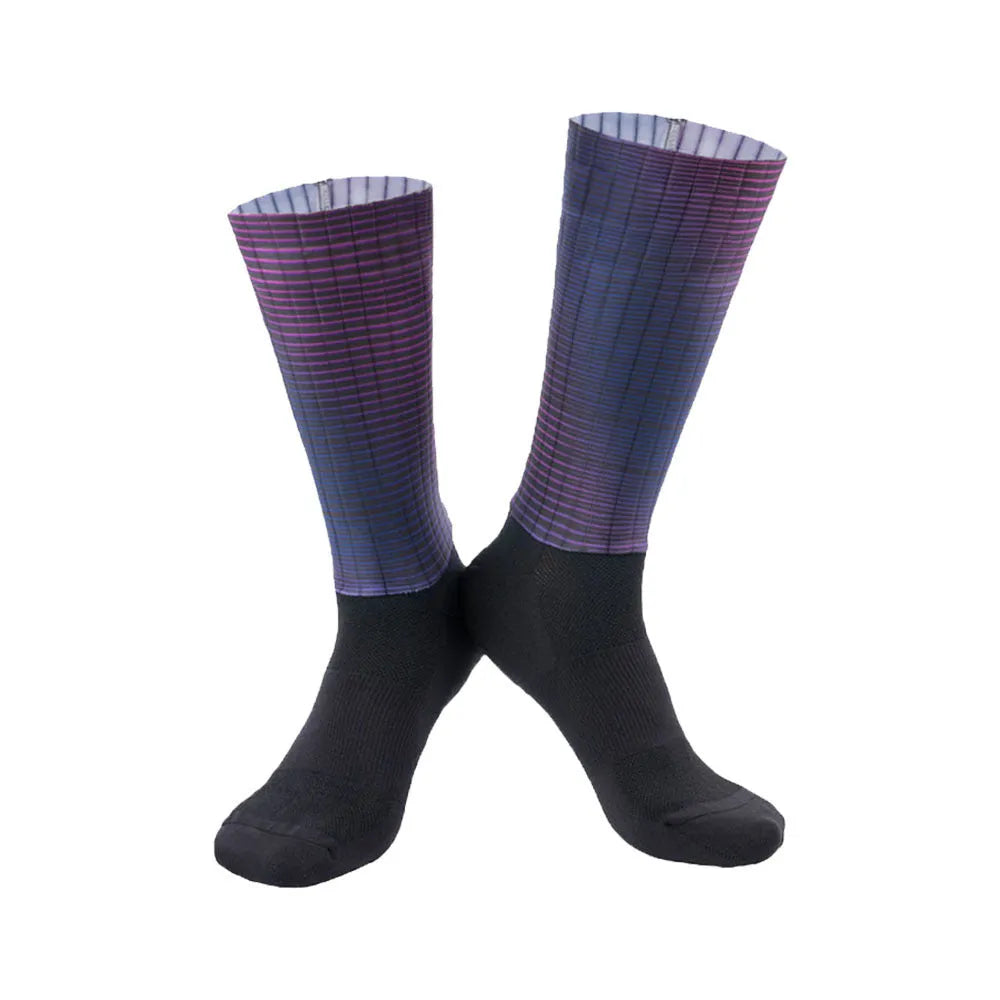 A pair of breathable cycling and running socks in an orange colour on a plain background.