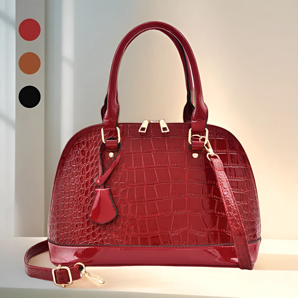 Shiny black PU leather crossbody shoulder bag with a structured shell shape