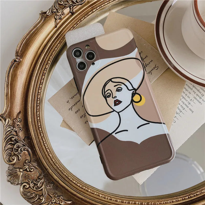 Orange yellow cartoon line art silicone protective case for iPhone on a phone.