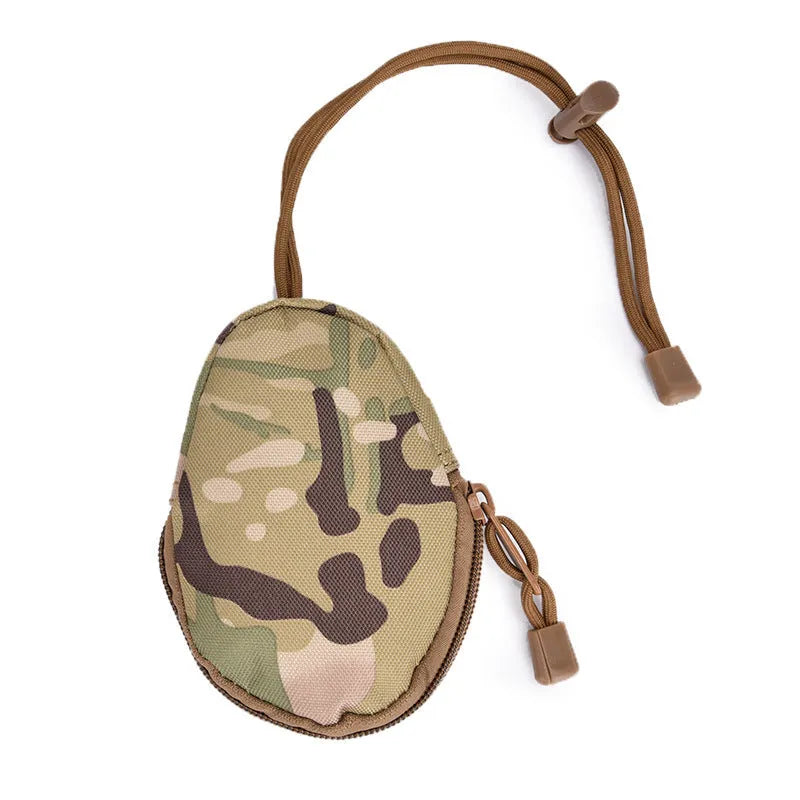 Black Oxford cloth outdoor key bag with zipper, shown next to a telescopic rope.