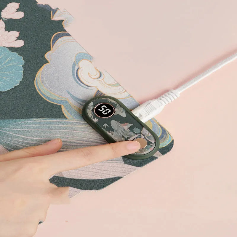 Electric desktop heating mat with PVC leather surface showing idyllic decorative pattern