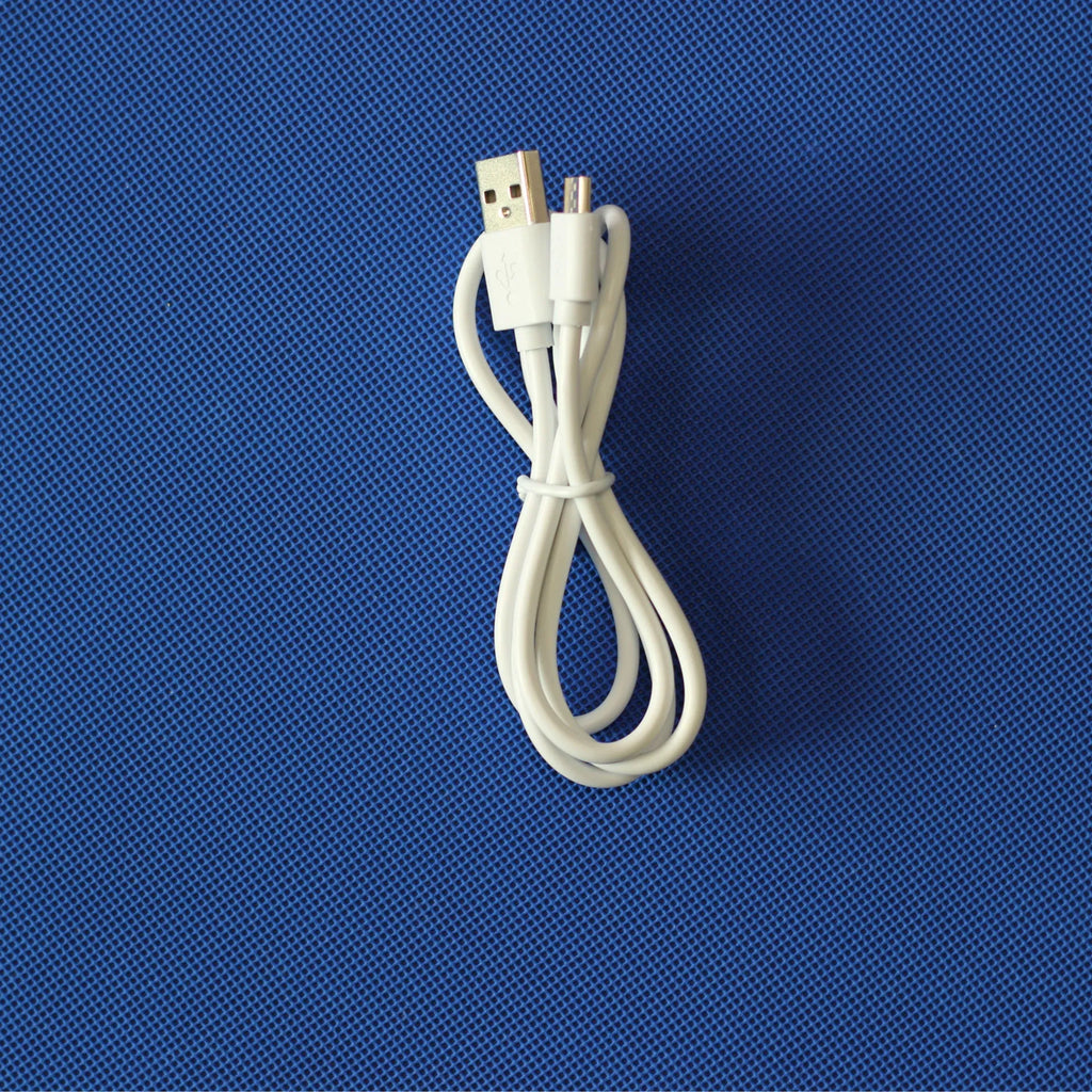 Black USB OTG cable with Mini USB and TYPE-C connectors on white background