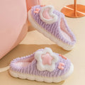 Light blue women's fleece-lined slippers with animal pattern, round toe, and thick sole.