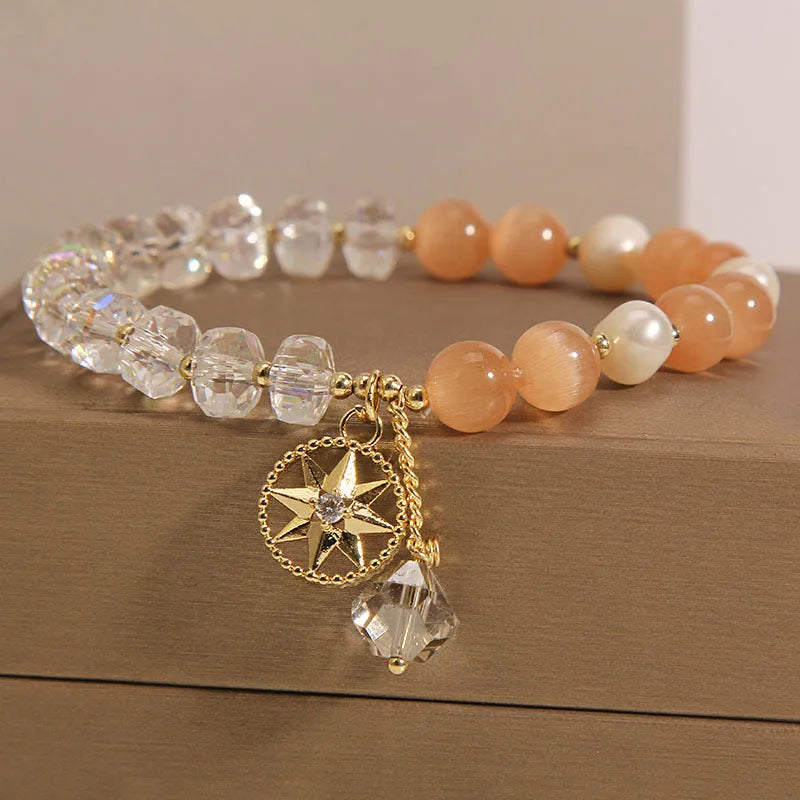 Orange eight-point star opal crystal bracelet with gold-plated settings