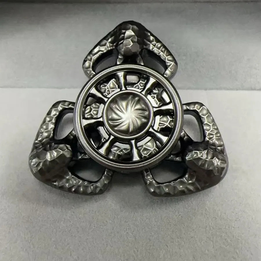 Flame Butterfly alloy metal rotating fingertip fidget gyro toy in colourful or space grey.