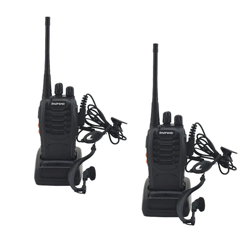 Black BF-888S walkie talkie with antenna and belt clip placed on dark surface