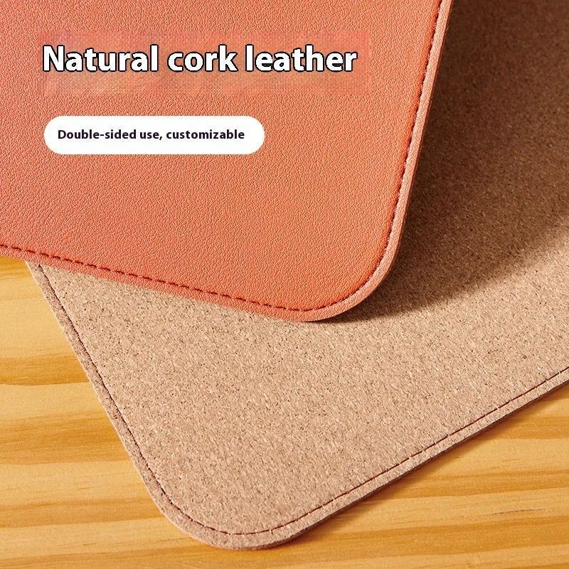 Leather cork PVC mouse mat in orange, 3.8mm thick, 80x40cm, on a wooden desk with a laptop and mouse