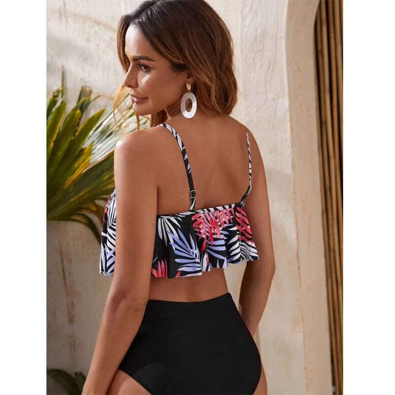 Women's white and blue floral printed high-waist bikini swimsuit with flounced detail.